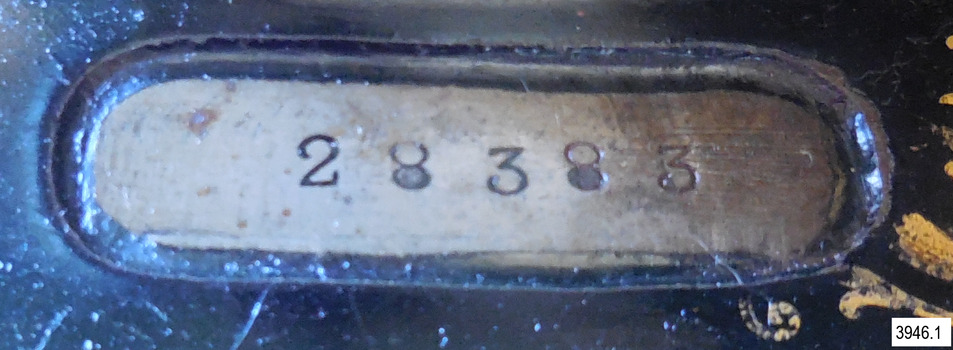 Machine's serial number '28383' impressed into machine