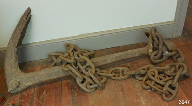 Anchor with one fluke, heavy short length of chain attached
