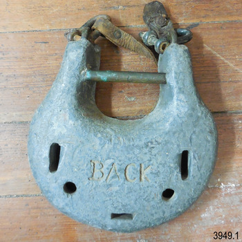 Disc shaped metal weight with slots for attaching straps