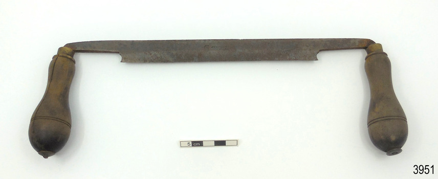 Metal spokeshave has straight edge, wooden handles are on an axle, maker's mark ion blade's centre