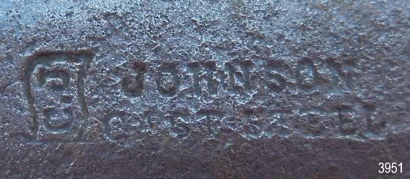 Maker's mark impressed into blade on front. It has a logo ; flag with 'C.J.' and two lines of text to its right