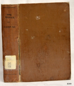 Brown hardcover with inscription on spine