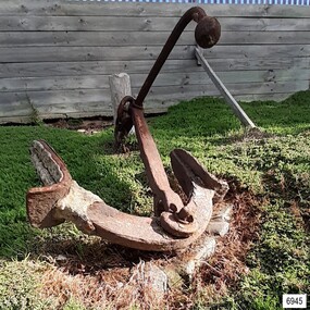 Anchor has two flukes with upright palms, rectangular section shank and round section stock