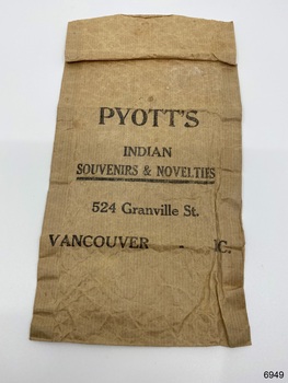 Front of a paper shopping bag from Pyott's, Vancouver Canada.