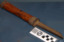 Wooden handle with metal reinforcing on ends, metal shaft that tapers down from handle to blade's end