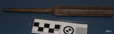 The metal tool has six flat sides on the handle and the shank tapers inwards