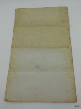 Discolouration on paper due to document being folded twice horizontally