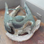 Remnants of grey paint on arch-shaped pintle and gudgeon, which are joined together