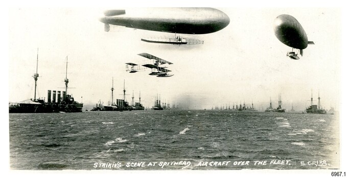 Aircraft and ships in black and white photograph