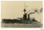Battleship in black and white photograph, funnels smoking
