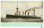 Battleship in black and white photograph with green bottom border