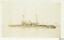 Battleship HMS LORD NELSON ailing in fog, flag outstretched above stern, sepia photograph