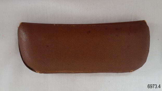 Textured cover on hard case with hinged top