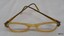 Arms on opaque yellow spectacles are reinforced with metal. The nose bridge is decorated.