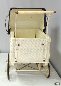 Hood and inside of pram are lined with white vinyl fabric