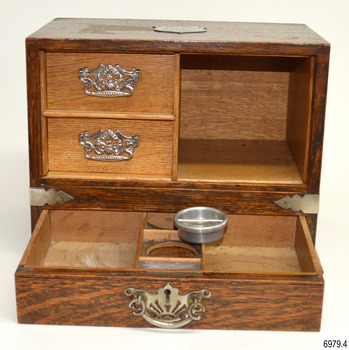 The bottom draw is fitted with a metal ashtray and match striker