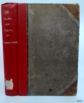 Spine cover is reinforced with red tape, corners of cover are reinforced with brown leather