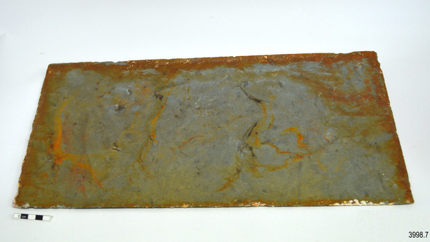 Remnants of encrustation on the edges of tile