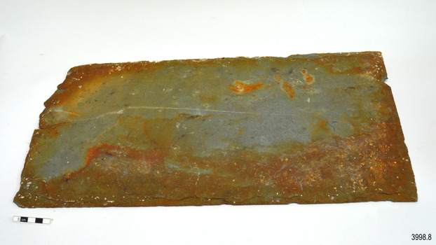 Tile has rough edges and a score mark