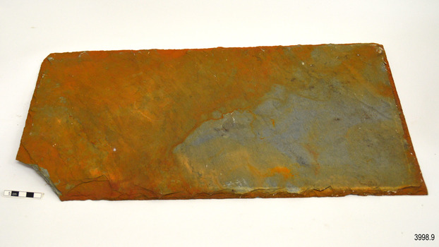 Tile has a broken corner and strong orange colouring