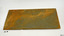 Tile has two holes drilled through. It has strong orange-brown stain over grey colour.