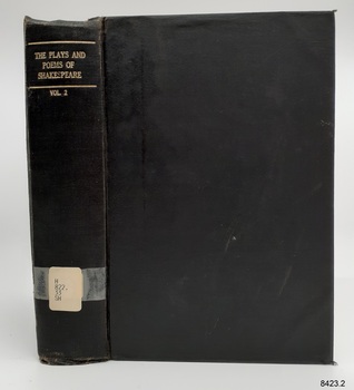 Black linen cover with gold embossed title on spine and white label attached