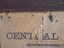 Poster has insect damage, fabric is torn, revealing newspaper beneather cloth