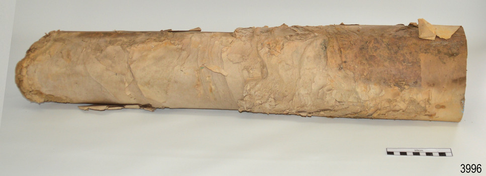 Paper is stained and peeling away in layers. The surfaces are crumpled.