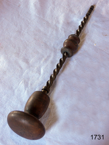 Drill has a round wooden handle and a wooden grip