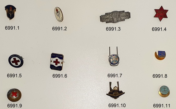 Three rows and four columns of badges
