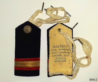 Epaulettes have a board base, covered by fabric and lined with leather