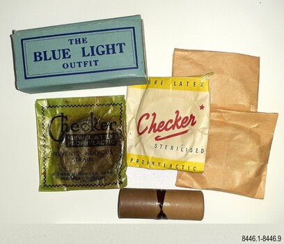 Contents include a rectangular blue box, four waxed envelopes and a small cardboard cylinder