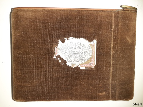 Brown velvet-covered rectangular metal case