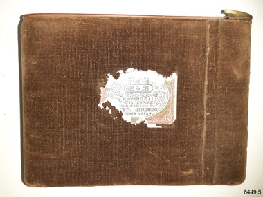Brown velvet-covered rectangular metal case