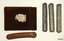 Case with long narrow cover, and three grey fabric covered tubes