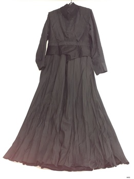 Black outfit with long sleeves and long skirt