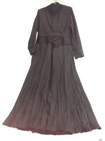 Black outfit with long sleeves and long skirt