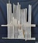 Blond wooden upright slats attached to timber horizontal rails, mortar between some of the slats