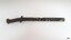 Large metal nail with metal washer attached. Nail is bent and has encrustations