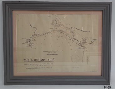 Chart in grey  painted frame behind glass, showing a bay between rivers and nearby towns