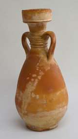 Amphora or jug of orange-yellow clay with bulbous base, wide mouth and two handles