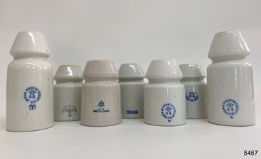 White porcelain insulator with manufacturer stamp