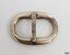 Solver-plated surface with nicks and scratches. Made from an oval and a bar shape.