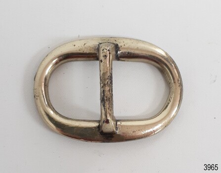 Solver-plated surface with nicks and scratches. Made from an oval and a bar shape.