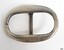 Oval buckle, solver plated, slight indentation on one short inner edge