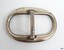 Silver-plated surface with nicks and scratches. Made from an oval and a bar shape.