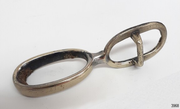 Silver-plated buckle. Encrustations inside one ring. Dents and scratches