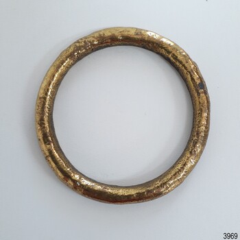 Gold coloured metal harness ring, with some gold paint mising