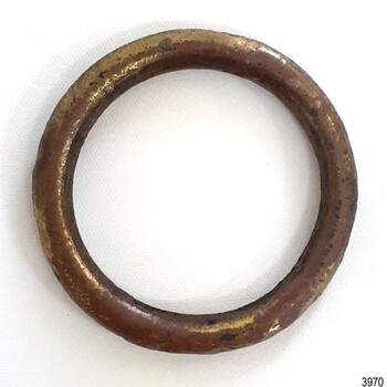 Round brass ring, tubular, with tarnished surface