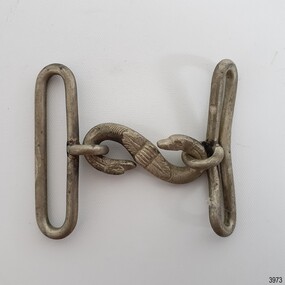 Metal buckle's 'S' hook has fine detail of the image of a swan on each end, with leaf motif in the centre